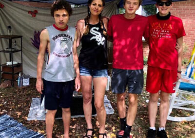 Sally's, son Kaegen and friends posing for a group pic at the Car Wash