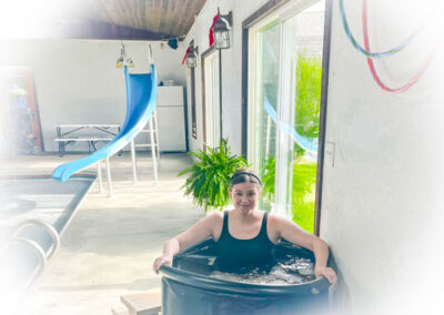 Kristen at Lakeview Wellness sitting in the Cold Dip Pool